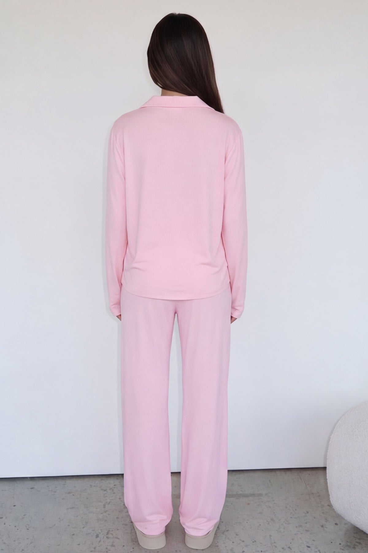 Pink long-sleeve pyjama set with trousers, back view on model