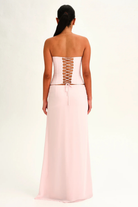Blush pink lace-up corset top and wrap maxi skirt, back view on model