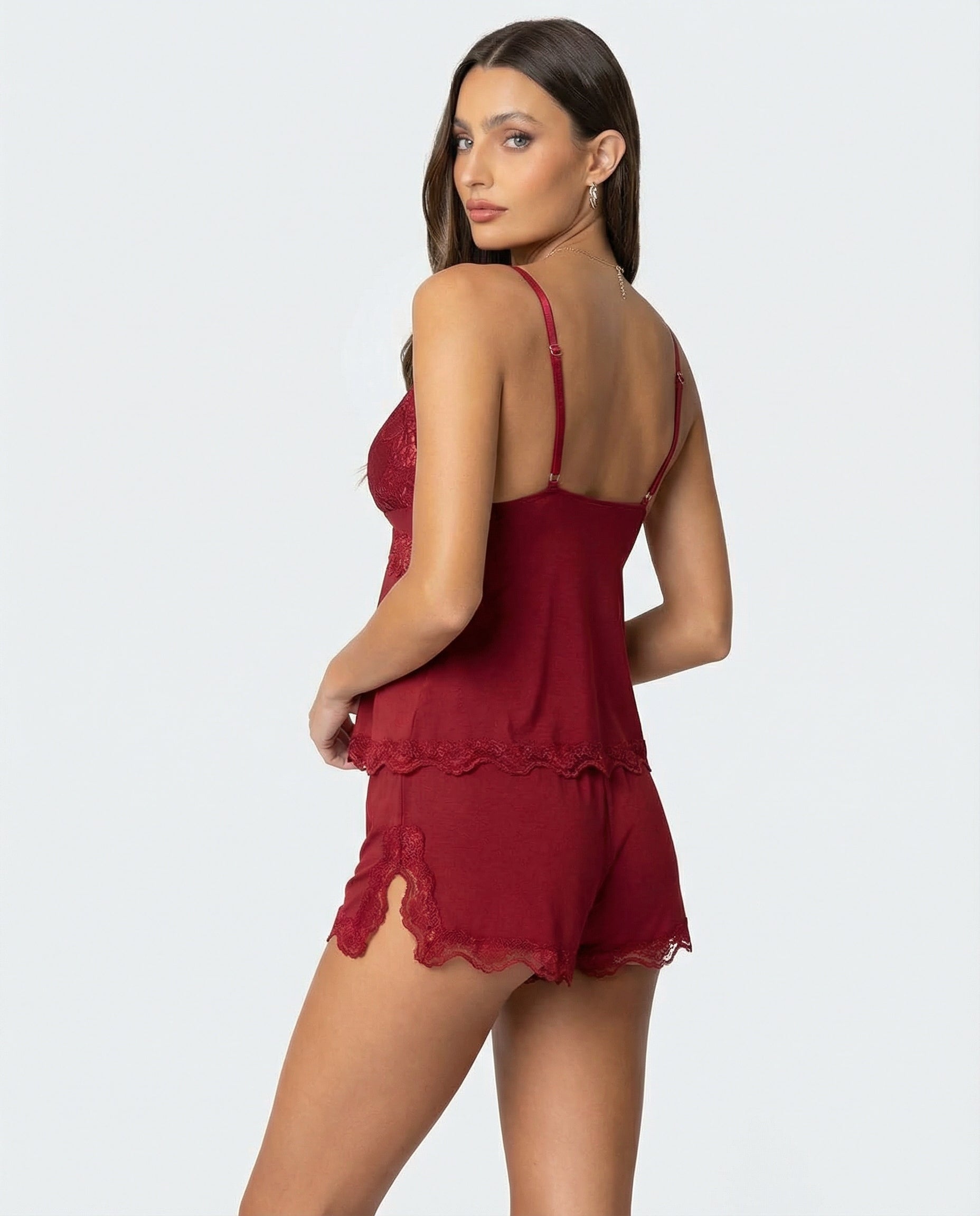 Burgundy lace-trim pyjama set, back view, model looking over shoulder