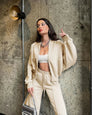 Beige oversized zip-up hoodie and joggers set, front view on model