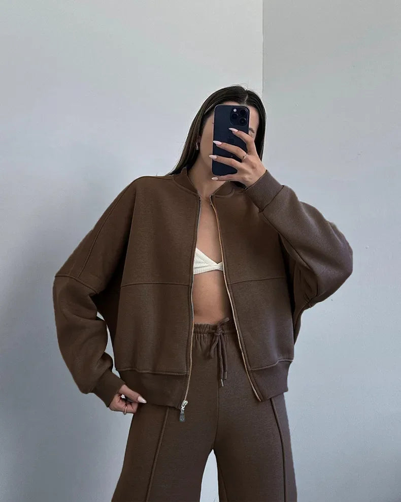 Brown zip-up hoodie and joggers set, mirror selfie on model
