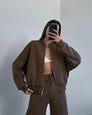 Brown zip-up hoodie and joggers set, mirror selfie on model