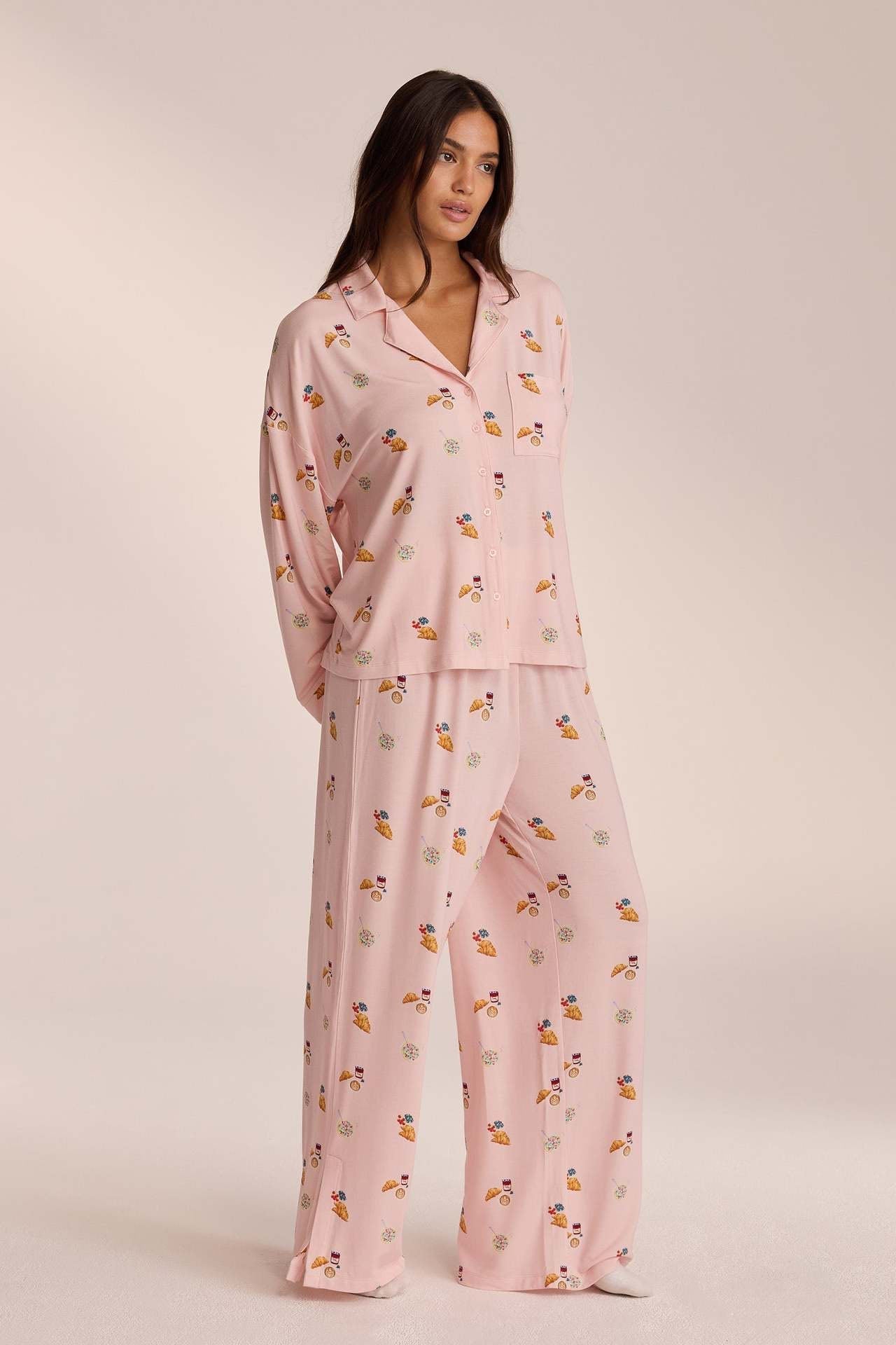 Pink breakfast-print pyjama set with trousers, angled front view