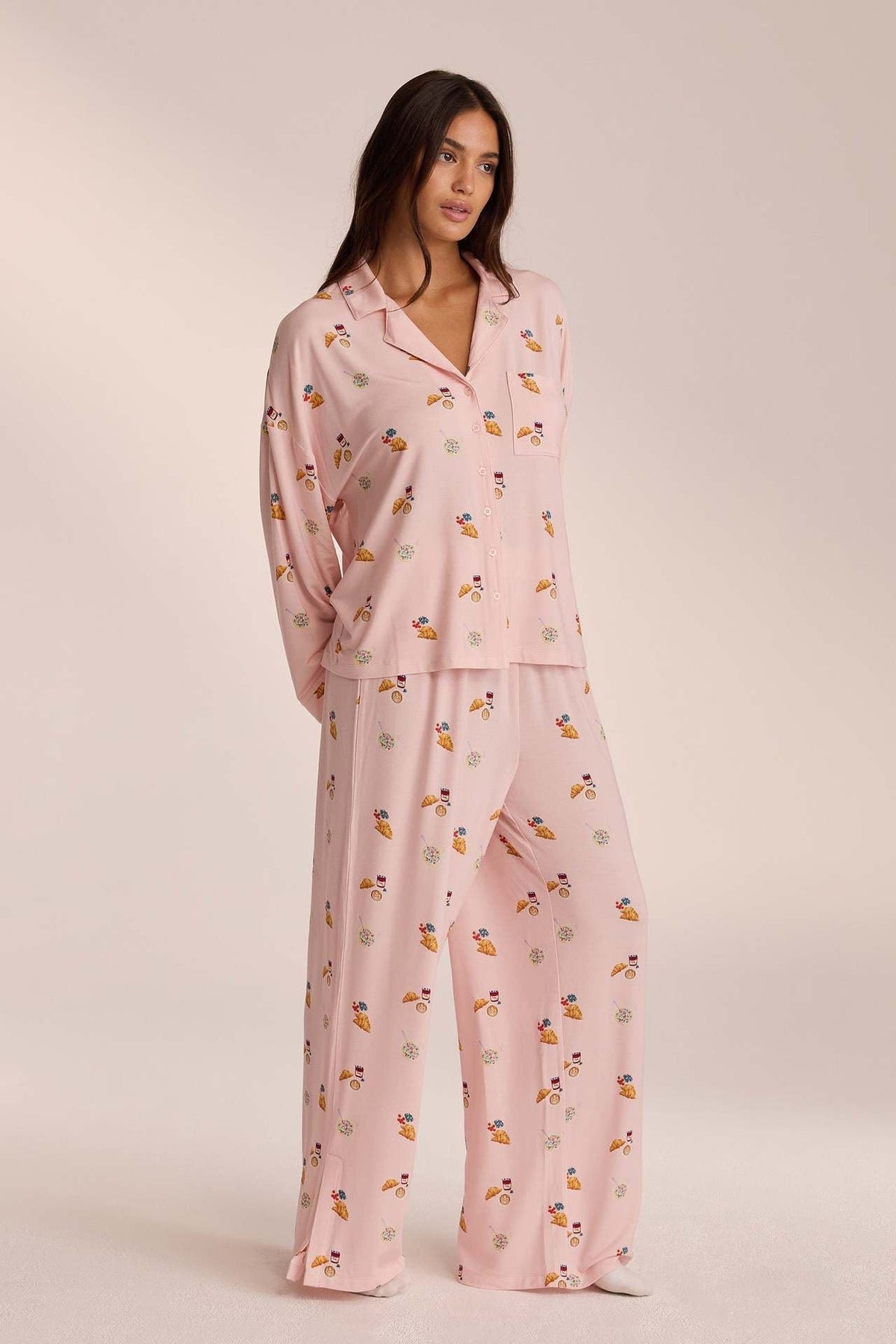 Pink breakfast-print pyjama set with trousers, angled front view