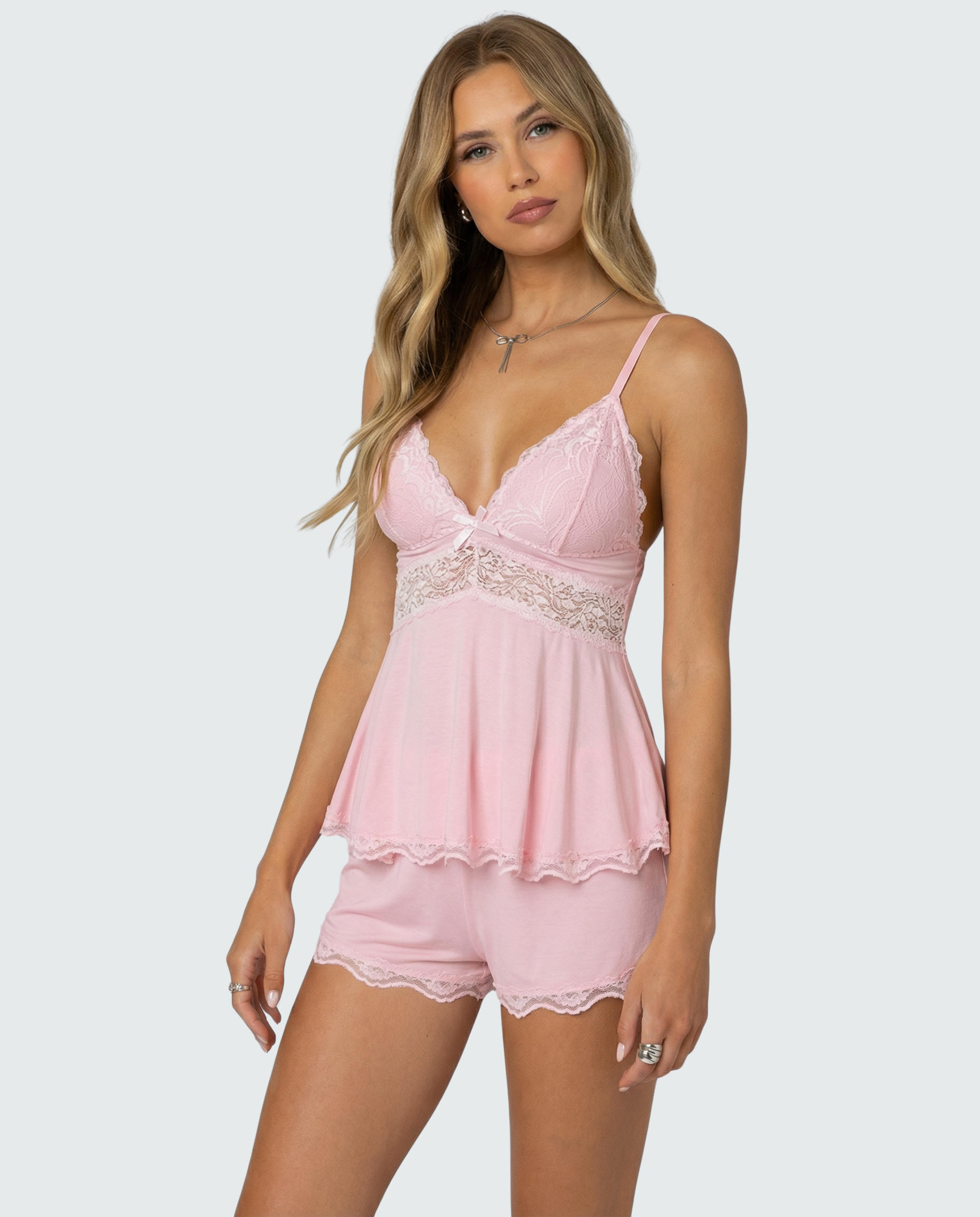Soft pink lace-trim pyjama set, three-quarter front view on model