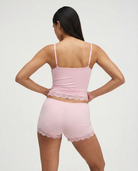 Soft pink lace-trim pyjama set, back view on model