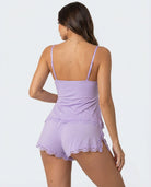 Back view of light purple lace-trim cami and shorts pyjama set