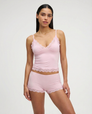 Soft pink lace-trim pyjama set, front view on model