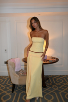 Lemon dot corset top and wrap maxi skirt, front view in hotel room