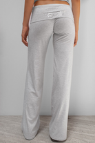Grey joggers with sequin wing detail on waistband, back view on model