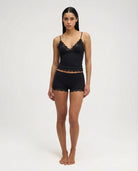 Black lace-trim pyjama set, full length front view on model