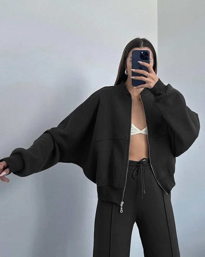 Black zip-up hoodie and joggers set, mirror selfie on model
