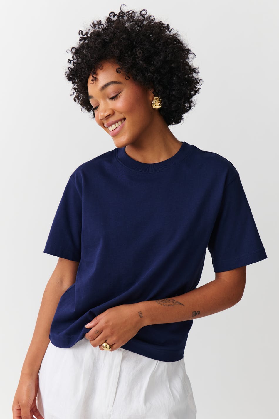 Deep navy cotton crew neck t-shirt, front view on model