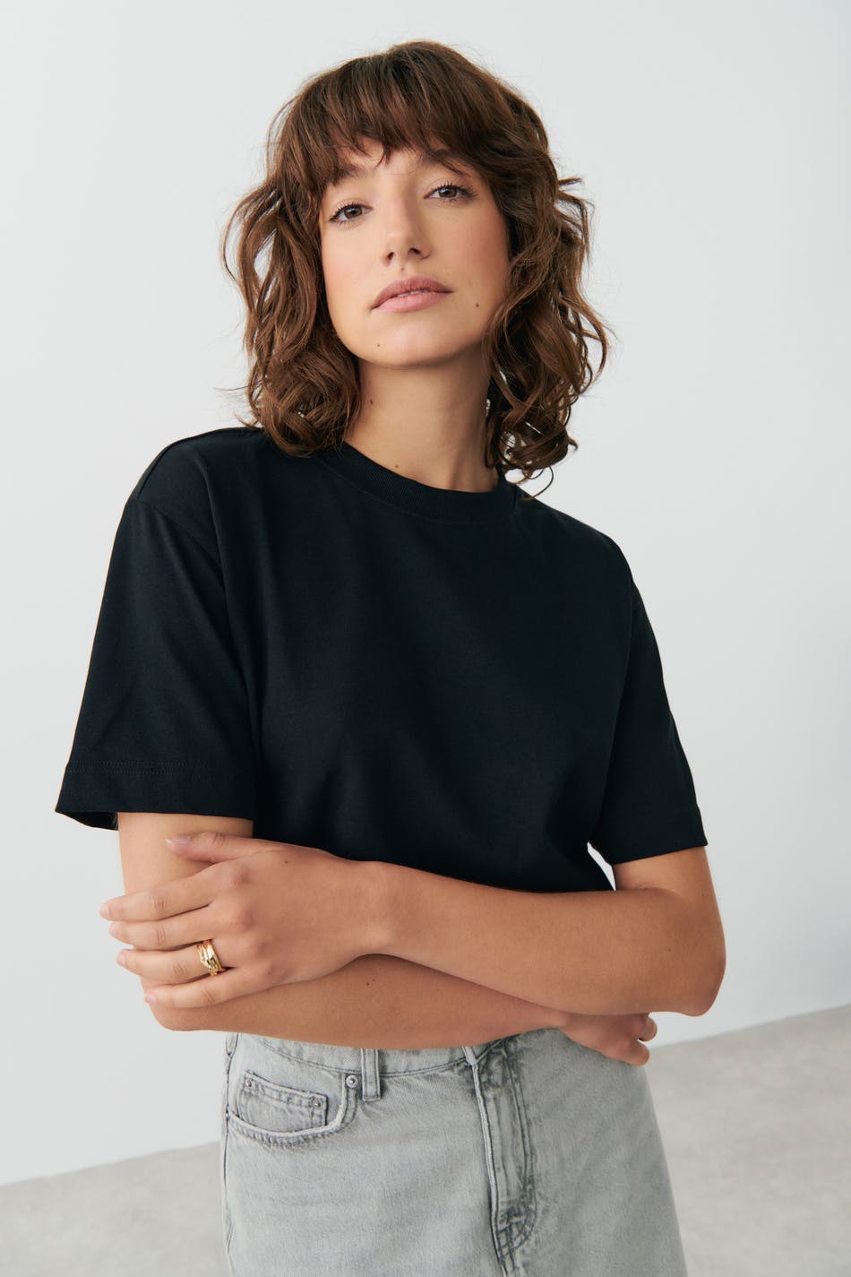 Black cotton crew neck t-shirt, front view on model