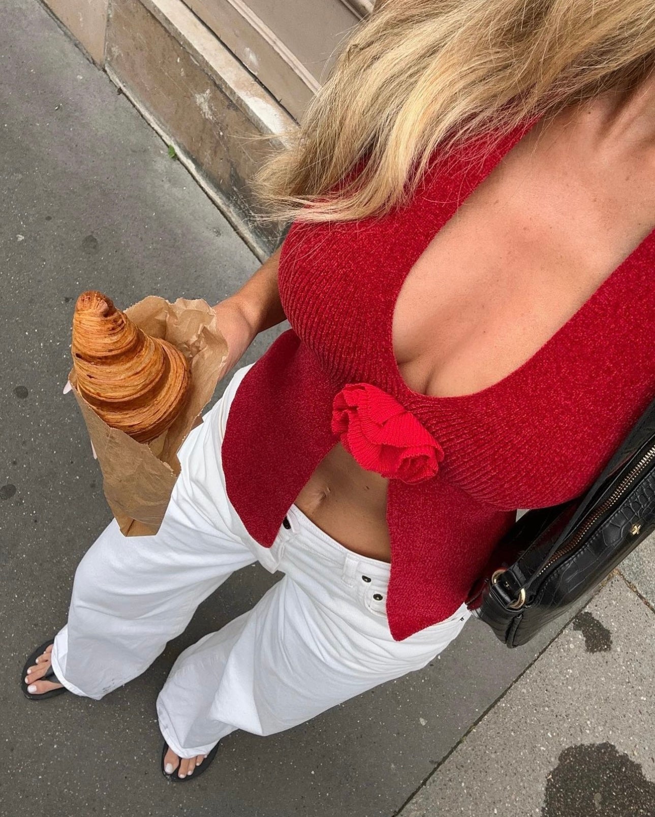 Red knit halter top with rose applique, overhead street style view