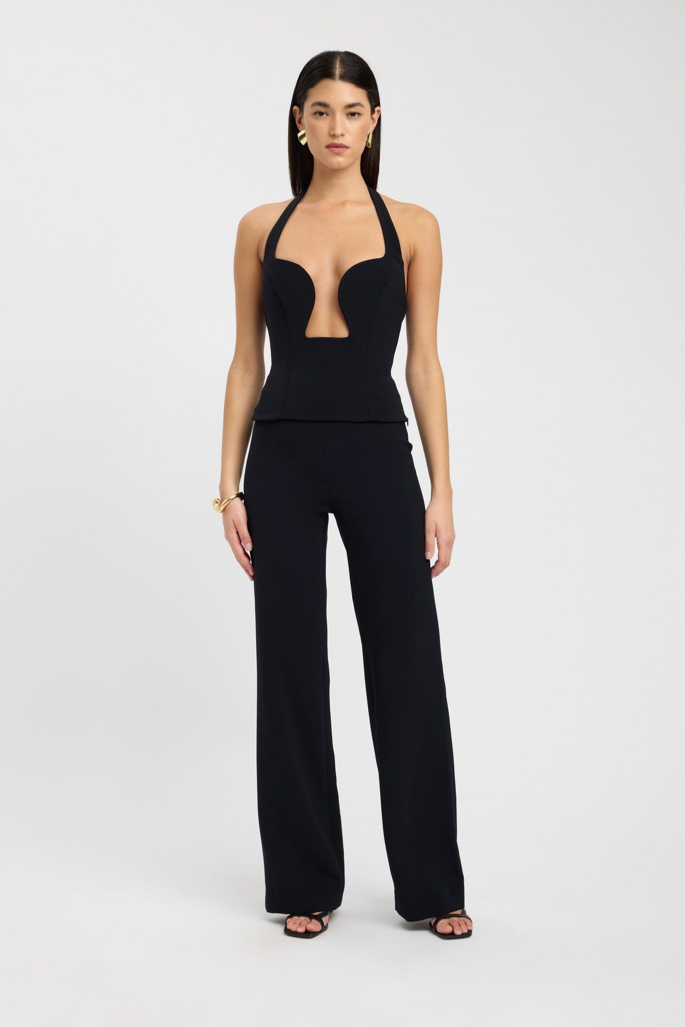 Black plunge bustier top styled with trousers, front view on model