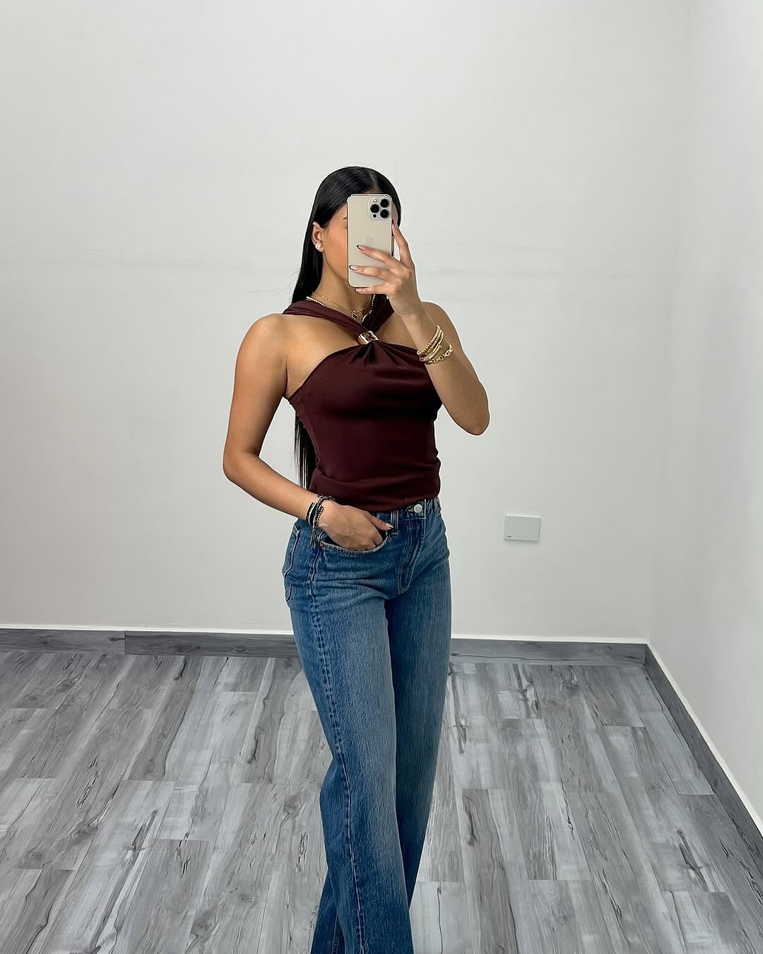 Burgundy criss-cross halter top, front view on model