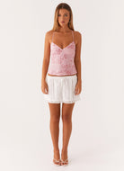 Pink sequin floral cami top, full length front view on model