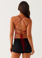 Red sequin floral cami top, back view with crisscross straps