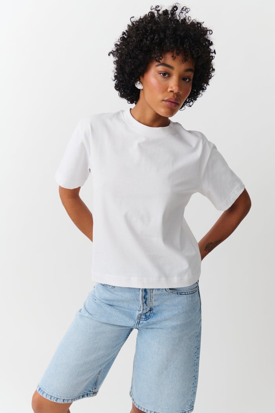 White cotton crew neck t-shirt, front view on model