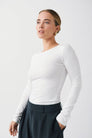 White fitted long sleeve top, front view on model