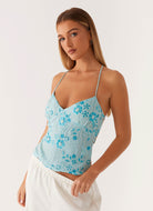 Blue sequin floral cami top, front view on model