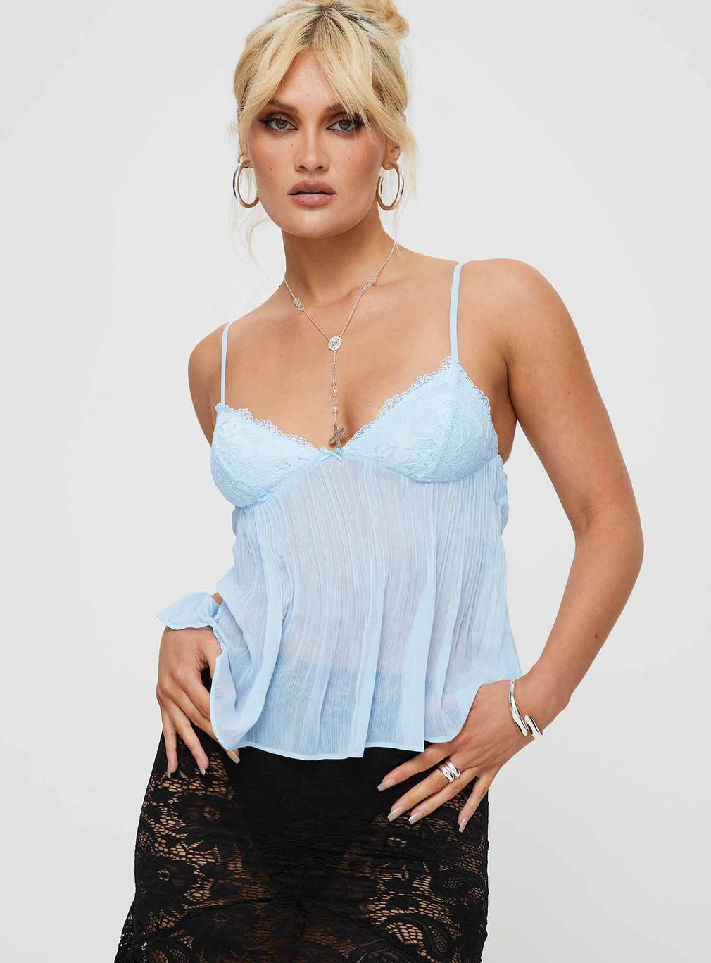 Blue lace pleated cami top, front view on model