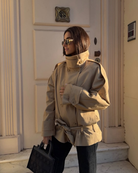 Camel cropped trench coat with belted waist, three-quarter view